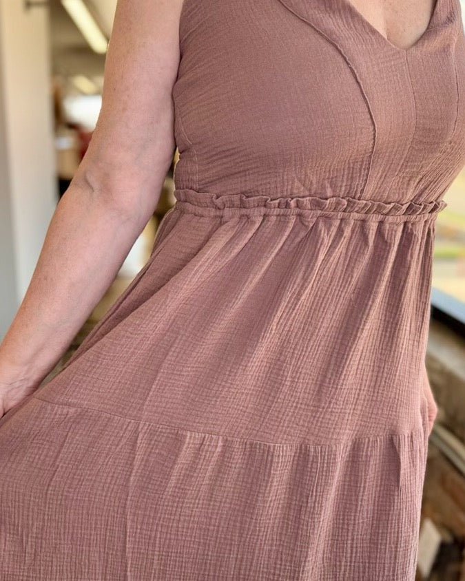 Close-up of ruffle elastic waistband and tiered cotton gauze fabric on Dex Gauze Tiered Midi Dress in Rose Taupe