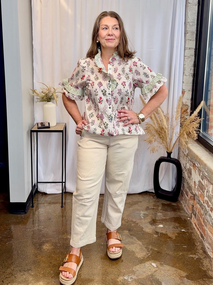 Entro ecru high-waist brushed cotton straight leg pant styled with floral ruffle blouse and tan platform sandals — women&