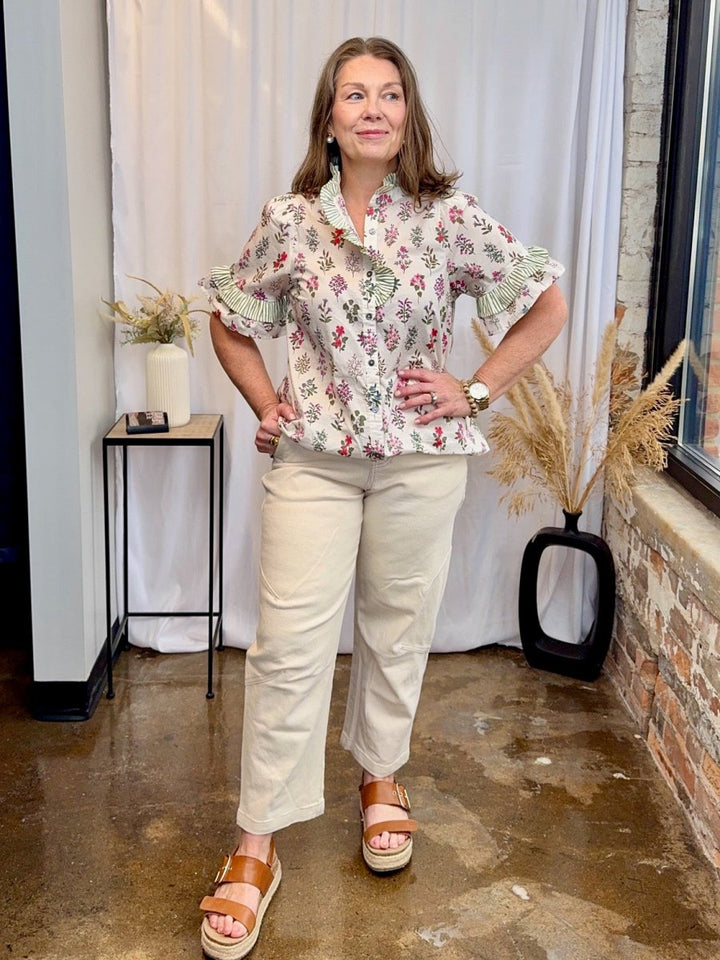 Entro ecru high-waist brushed cotton straight leg pant styled with floral ruffle blouse and tan platform sandals — women&