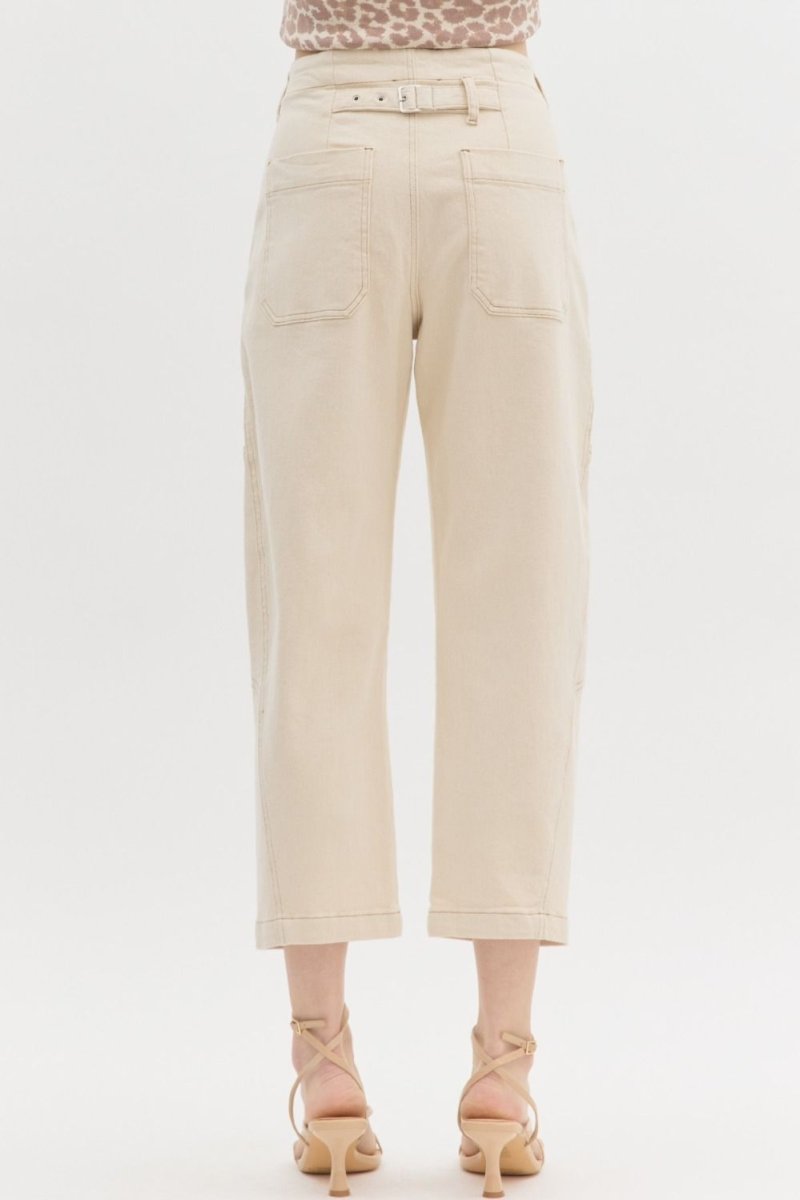 Woman wearing Entro ecru high-waist straight leg pants featuring back buckle at waist.