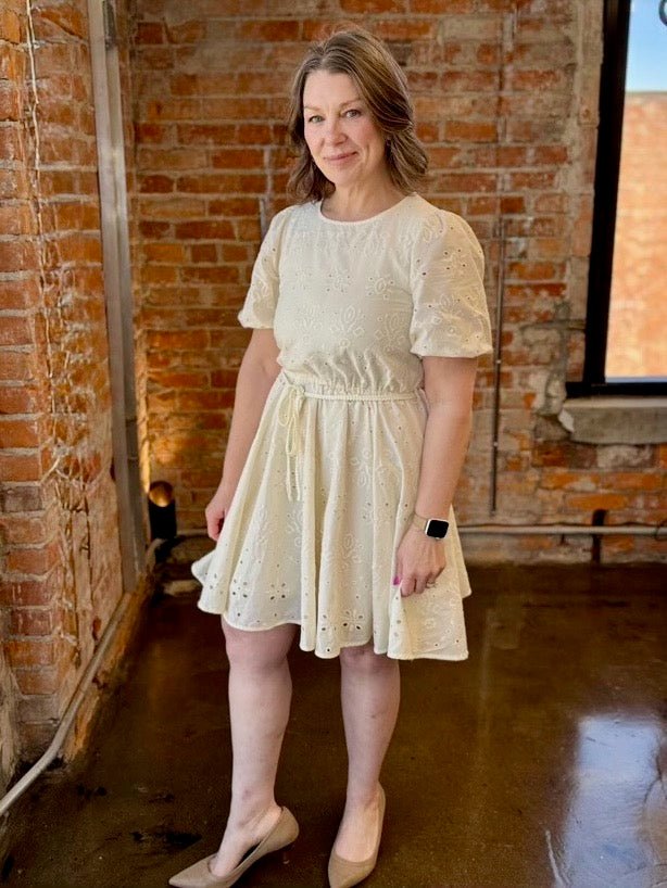 Black Tape Eyelet Belted Mini Dress in Ecru, puff sleeve crewneck with rope belt and full eyelet skirt, front view on model
