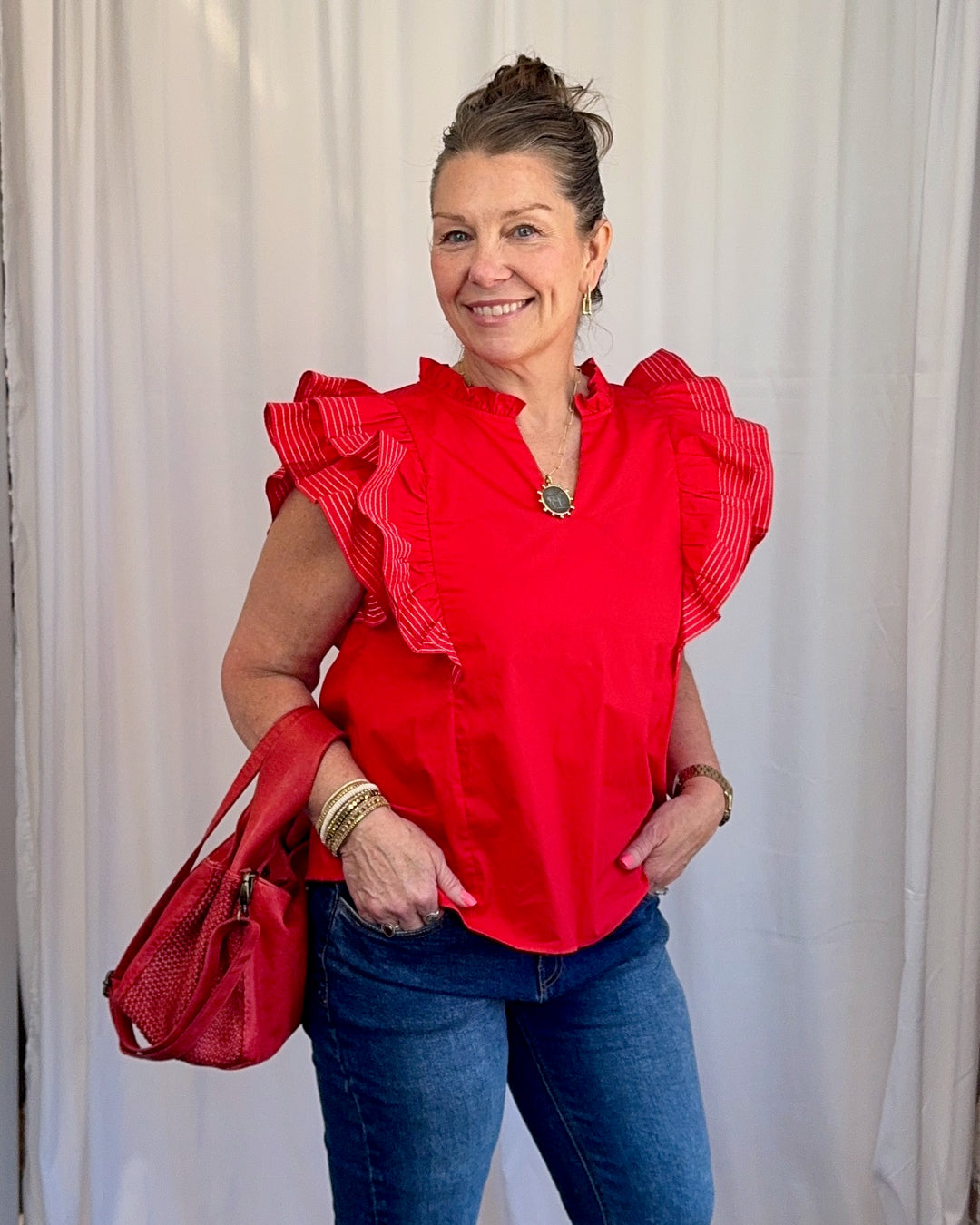Carole Christian Game Day Flutter Sleeve Top in Red — ruffle split V-neckline close-up detail, model wearing Small, Modish Maven Boutique