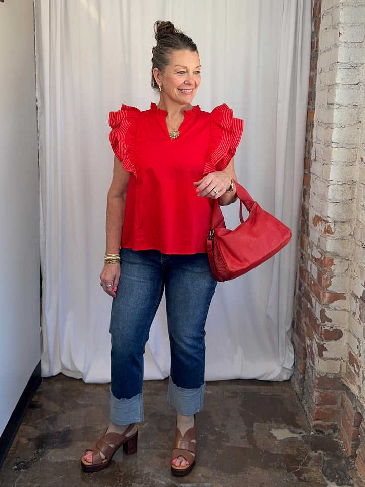Carole Christian Game Day Flutter Sleeve Top in Red styled with dark wash jeans and red shoulder bag, model wearing Small, Modish Maven Boutique