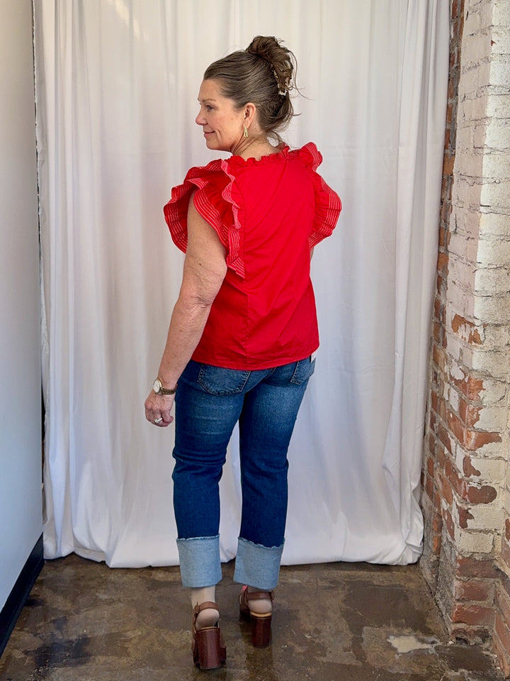Carole Christian Game Day Flutter Sleeve Top in Red — full back view styled with dark wash jeans and brown platform sandals, model wearing Small, Modish Maven Boutique