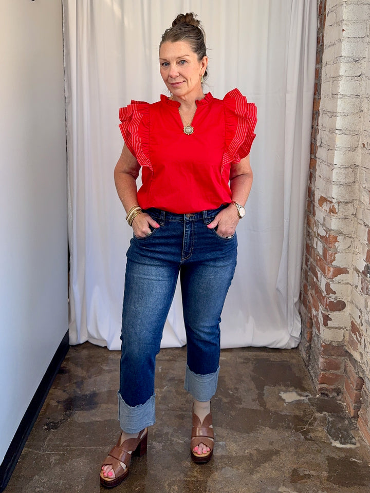 Carole Christian Game Day Flutter Sleeve Top in Red — front tucked-in styling with dark wash jeans, model wearing Small, Modish Maven Boutique