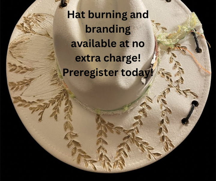 A cream-colored wide-brim hat with gold leaf embroidery and a small green leaf accent, shown against a black background with promotional text overlaid across the center.