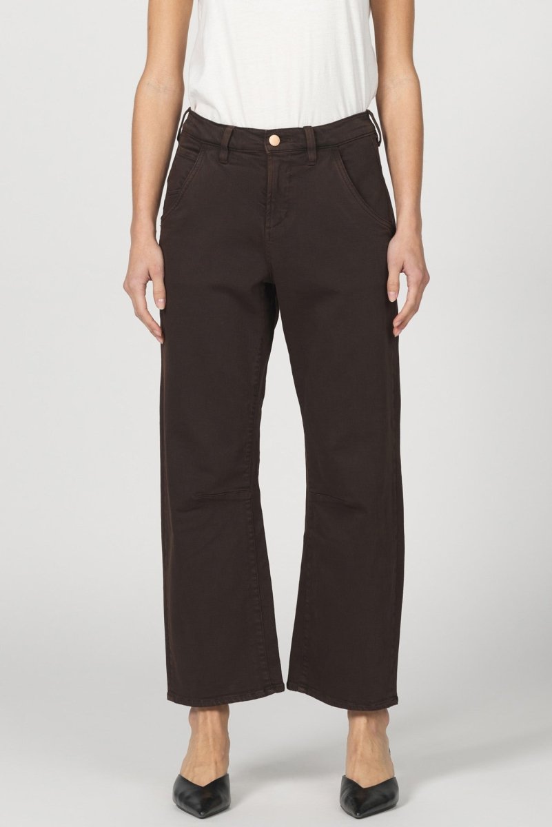 Person wearing brown pants on a white background