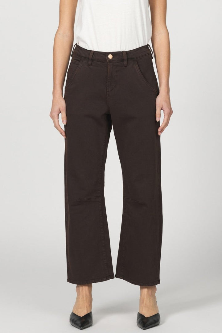 Person wearing brown pants on a white background