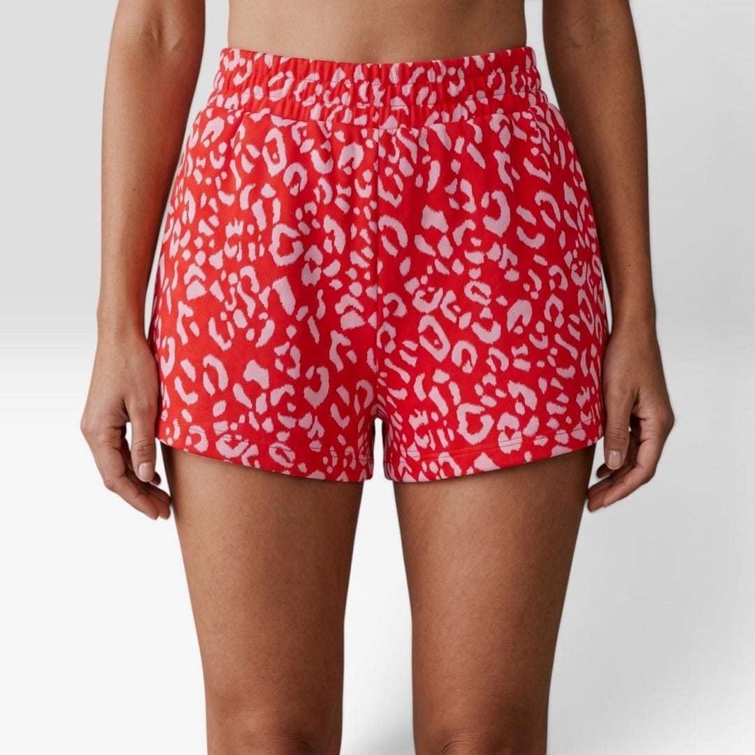 Leopard Print Shorts in Red Pink close-up front view, wide elastic waistband and side pockets detail