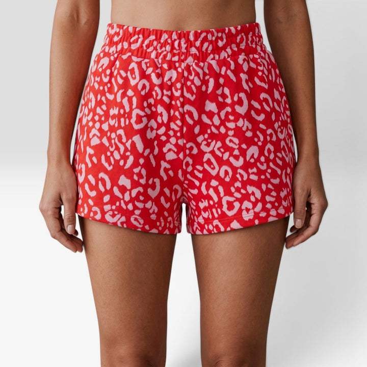 Leopard Print Shorts in Red Pink close-up front view, wide elastic waistband and side pockets detail