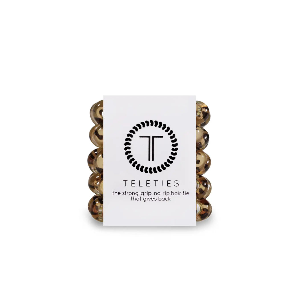 A packaged set of TELETIES tiny brown hair ties designed for kids and fine hair.
