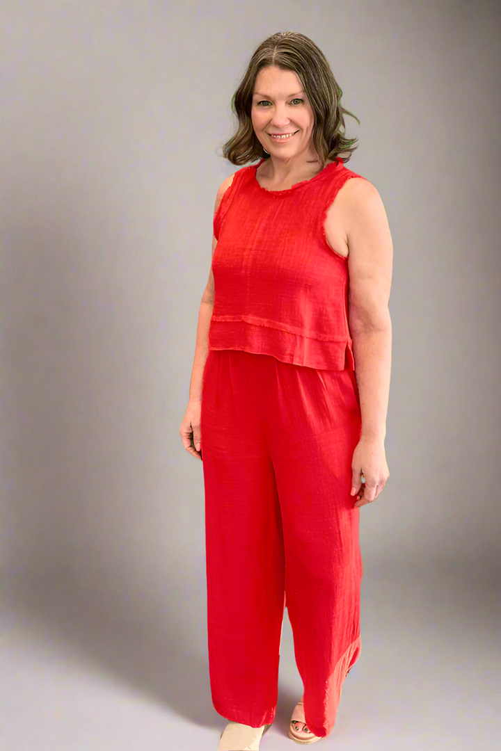 Woman smiling wearing the Tomato Red Linen Tank and Wide Leg Pant Set.