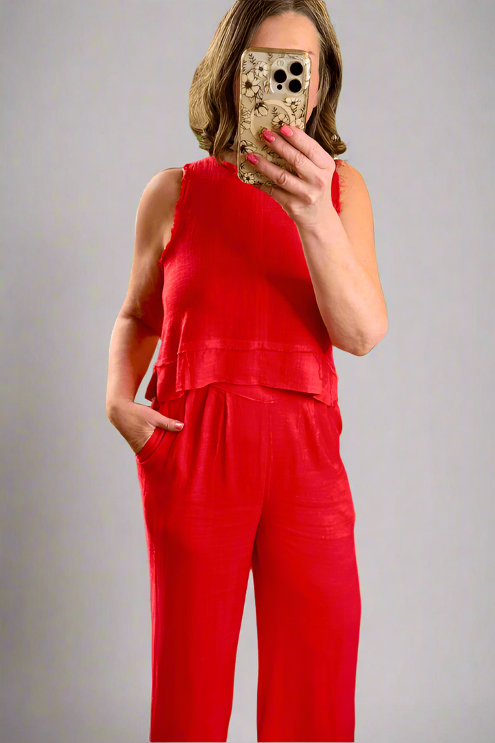 Woman taking a sellfie wearing the Tomato Red Linen Tank and Wide Leg Pant Set.