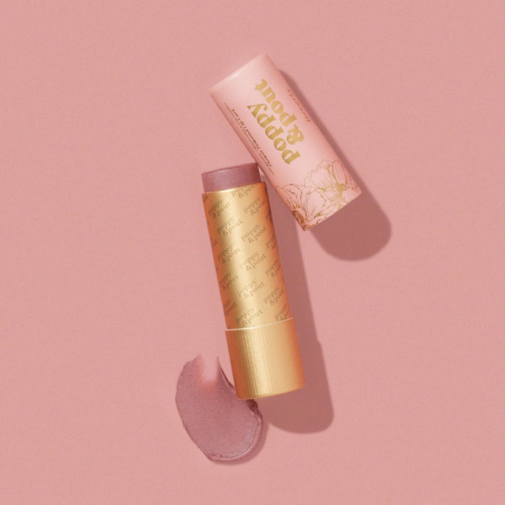 Poppy &amp; Pout Beverly Lip Tint in an 100% recyclable tube, revealing the mauvy pink natural balm for an effortless look.