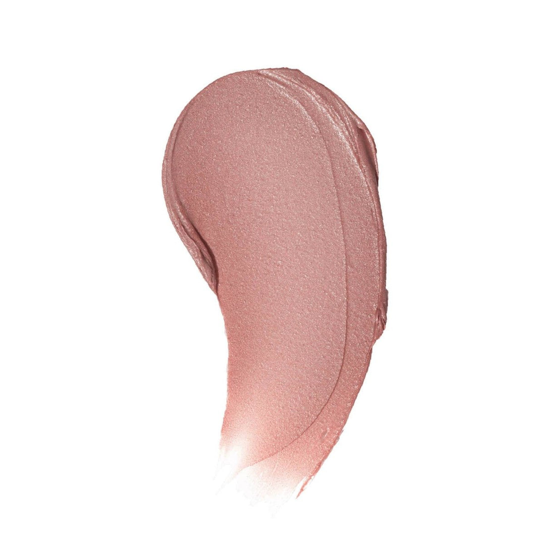 A smooth color swatch of Charlie Lip Tint on white background, displaying the sheer nude pigment and natural, creamy texture.
