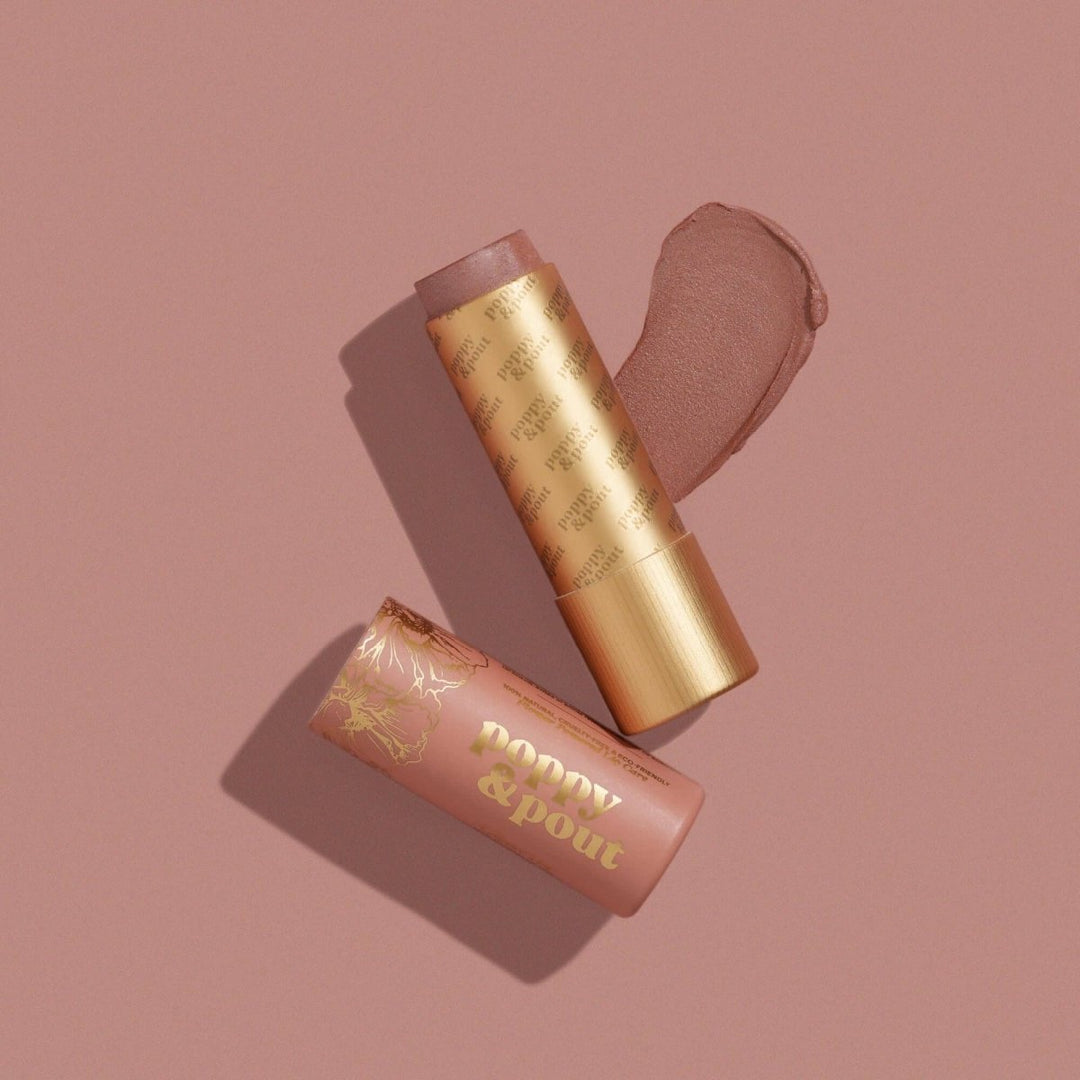 Poppy & Pout Charlie Lip Tint in eco-friendly cardboard packaging, featuring a sheer nude natural balm with cool undertones.