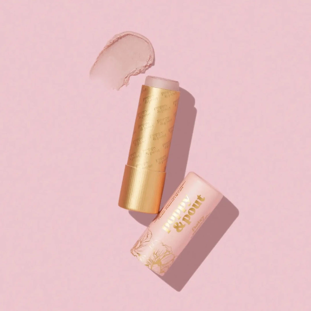 Poppy and Pout Daisy Lip Tint in sustainable cardboard packaging, featuring a light pink natural balm with cool undertones.