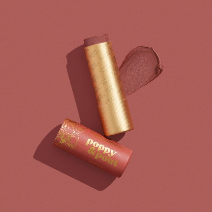Poppy &amp; Pout Debbie Lip Tint in eco-friendly packaging, featuring a dark peach natural balm for a sun-kissed look.