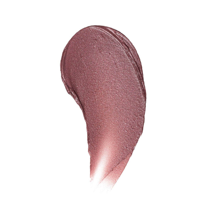 A smooth, buttery color swatch of Donna Lip Tint on white background, displaying the rich plum pigment and natural texture.