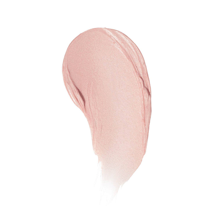 A creamy color swatch of Farrah Lip Tint on a white background, displaying its buttery texture and warm, light pink pigment.