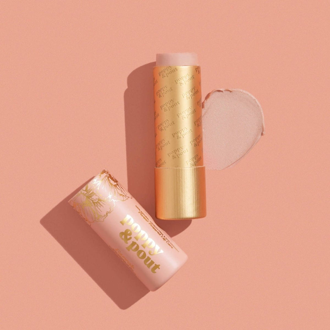 Poppy & Pout Farrah Lip Tint in a sustainable cardboard tube, featuring a sheer pink balm for effortless style.