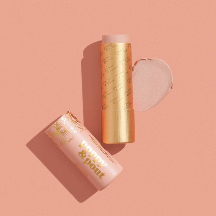 Poppy &amp; Pout Farrah Lip Tint in a sustainable cardboard tube, featuring a sheer pink balm for effortless style.