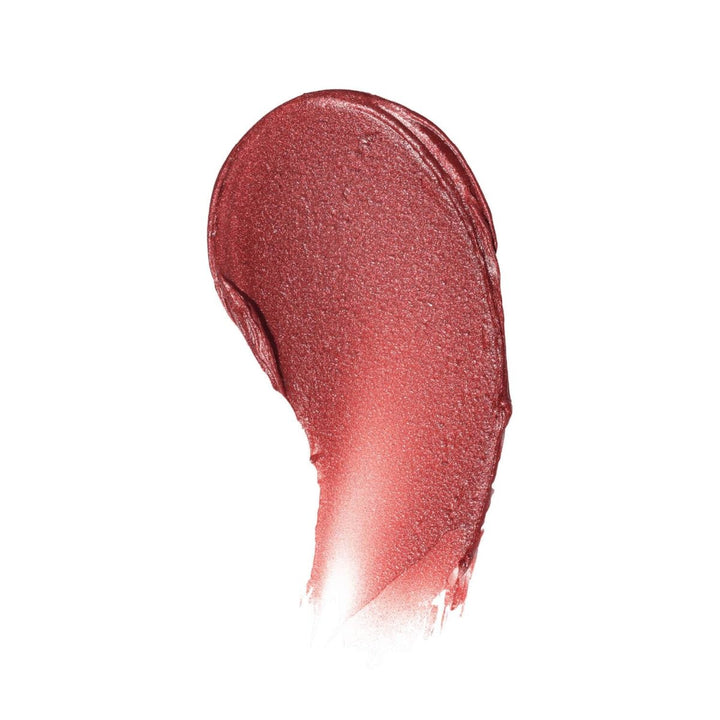 A buttery color swatch of Penny Lip Tint on white background, displaying the vibrant red pigment and smooth, natural texture.