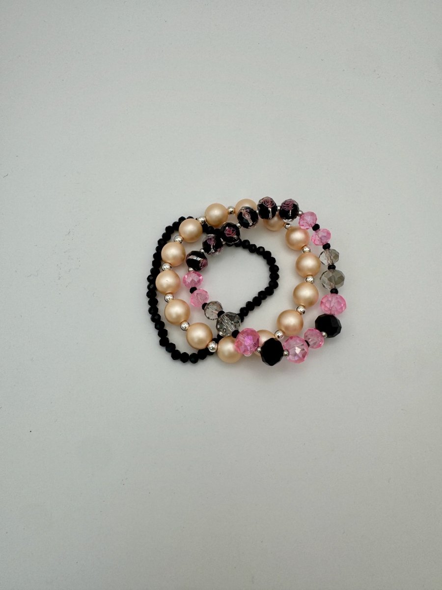 Lizzy Lu Diva Bracelet Set in Blush Noir — flat lay showing black, mixed pink, and pearl-like bead strands