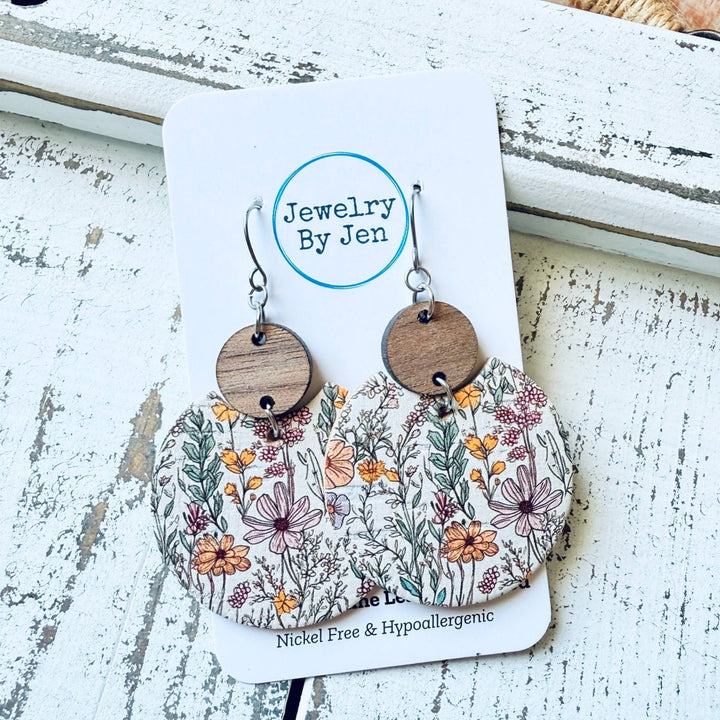 Wooden earrings with floral design on a &