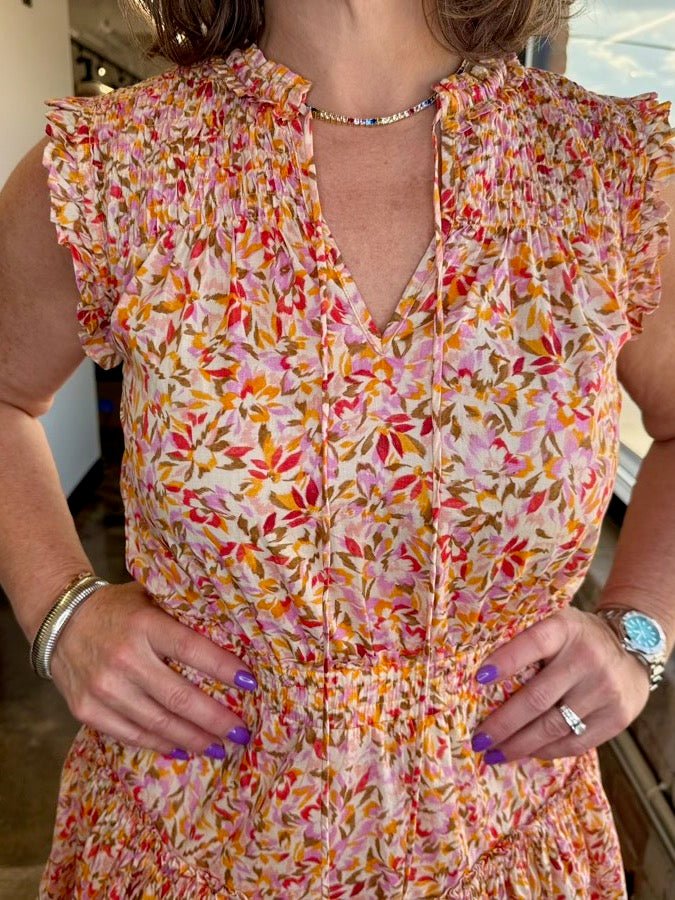 Dear John Denim Melodie Ruffle Cotton Dress in Superbloom Print, smocked bodice, ruffle cap sleeves, close-up detail on model