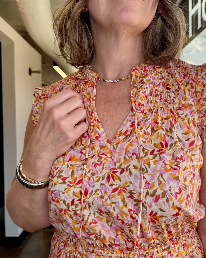 Dear John Denim Melodie Ruffle Cotton Dress in Superbloom Print, smocked ruffle neckline, shoulder detail, close-up on model