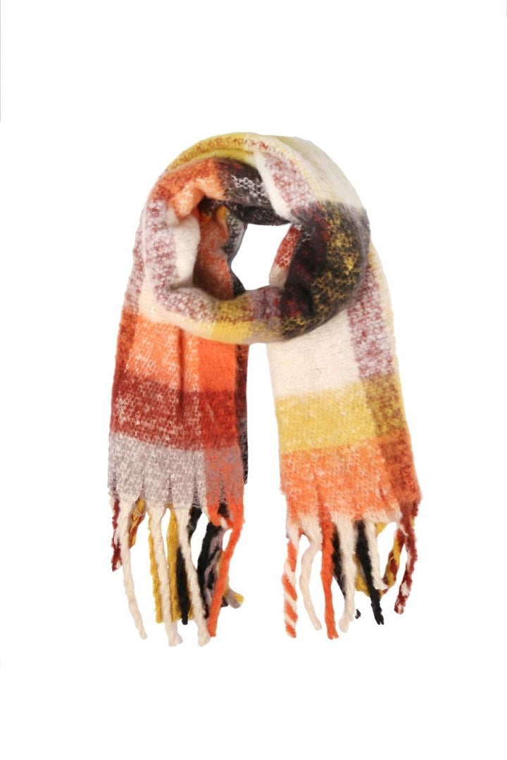 Plaid fringe scarf against a white background.