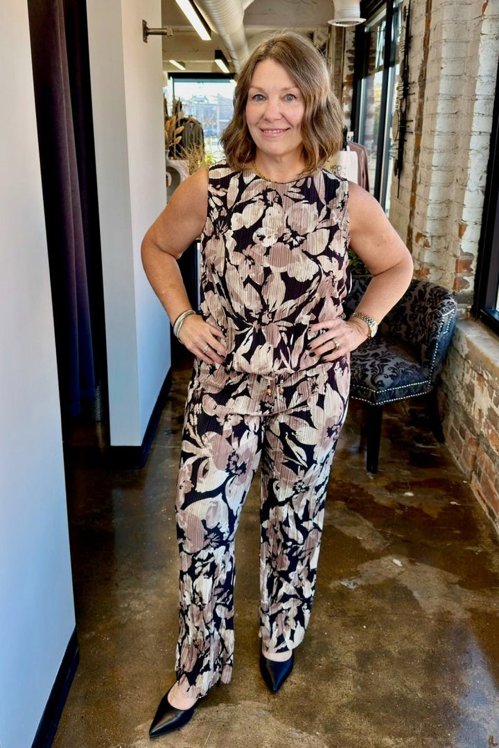 A full-length view of a sleeveless women&