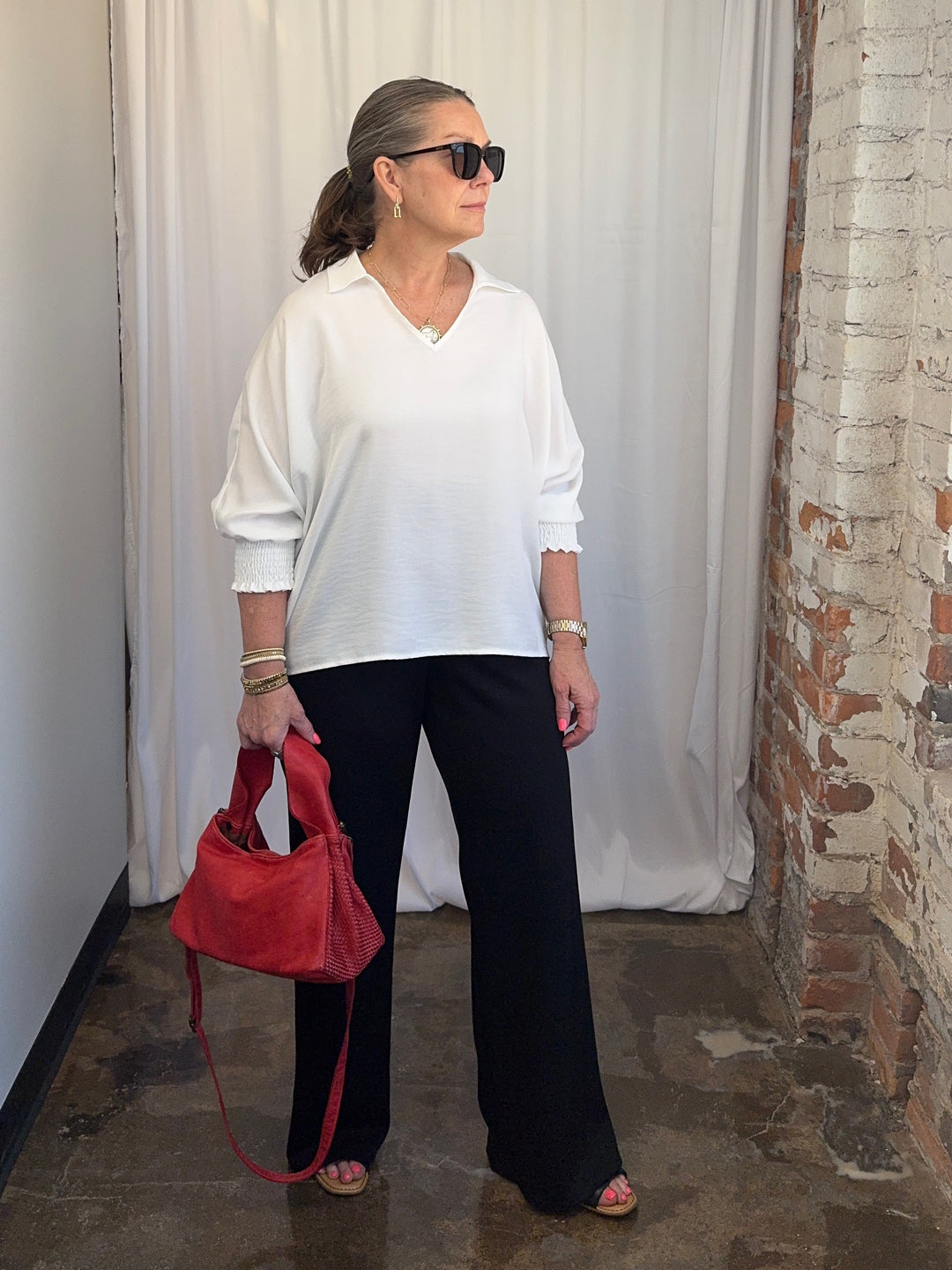 Carole Christian Relaxed Collar V-Neck Smocked Sleeve Blouse in White — full outfit view on model, untucked