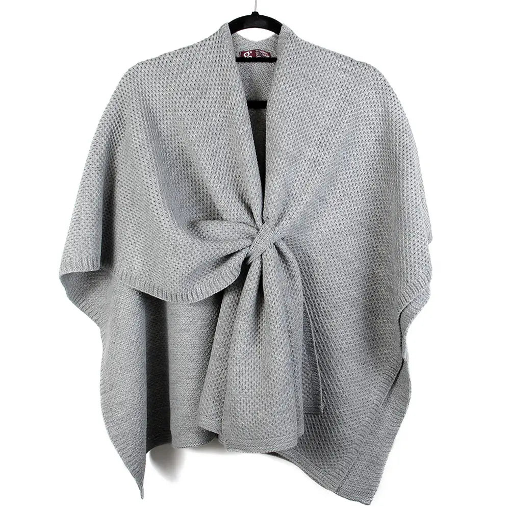 Ribbed Knit Loop Wrap in Gray — front view on hanger showing pull-through closure and ribbed edging
