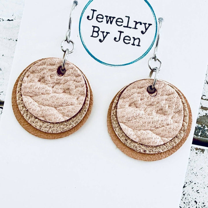 Cork, genuine leather, and wood earrings on a &