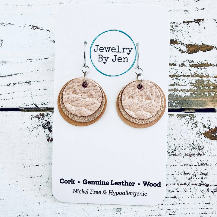 Pair of cork, genuine leather, and wood earrings on a &