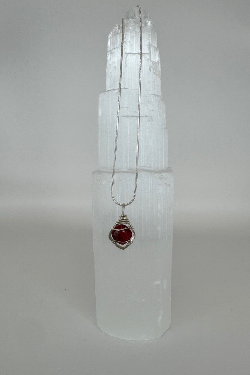 Raw Ruby Wire-Wrapped Pendant Necklace in Red &amp; Silver — full necklace displayed on white selenite