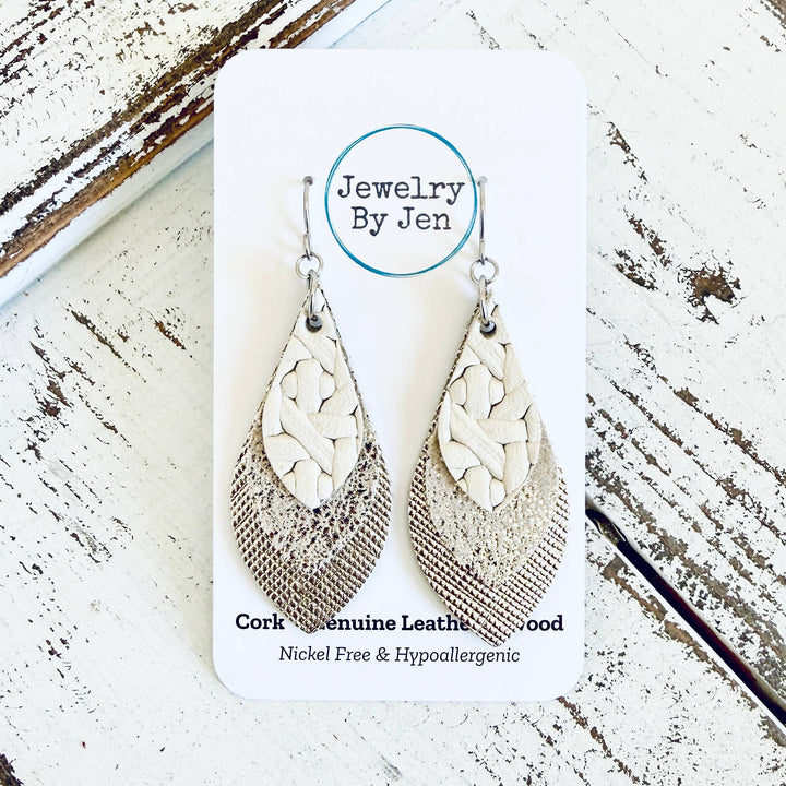 Pair of cork and leather earrings on a &