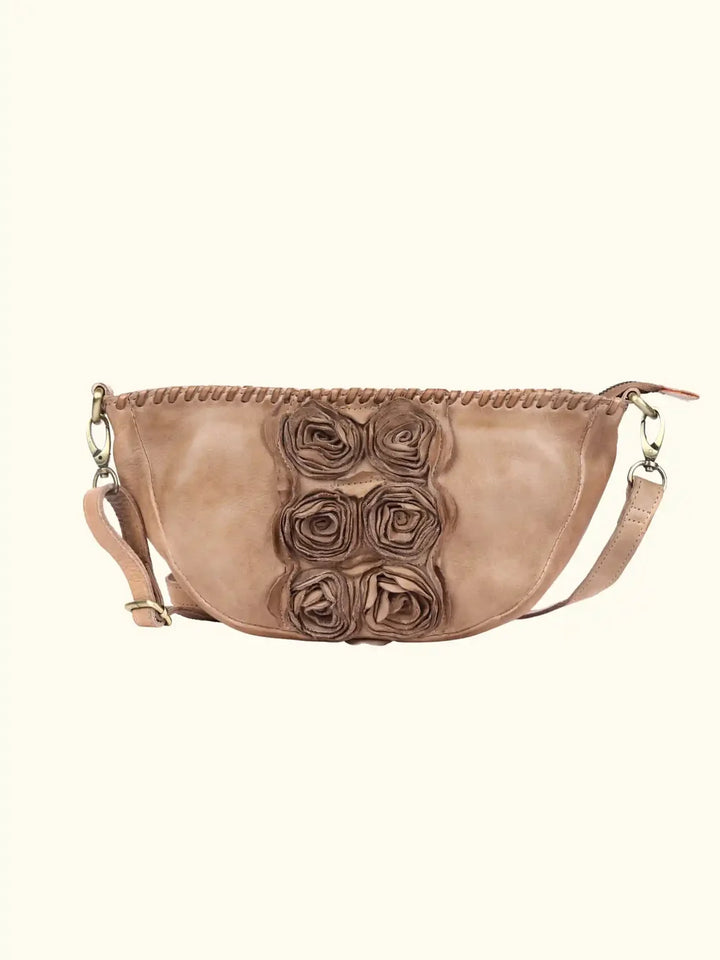 Sluce Washed Leather Bag in Taupe — front three-quarter view showing sculpted silhouette and strap