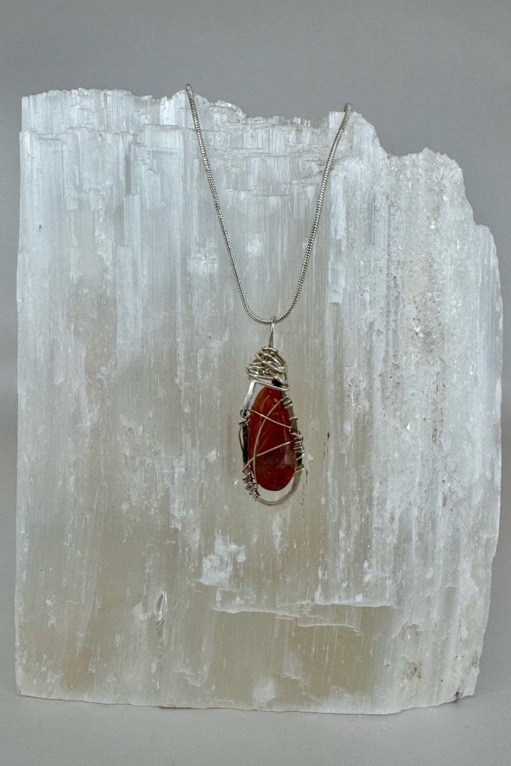 Wire-Wrapped Sunstone Pendant Necklace in Orange &amp; Silver — full necklace displayed against white selenite