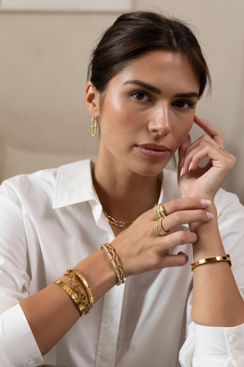 Tia U Link Pave Earring in Gold — model styled with white shirt and gold jewelry