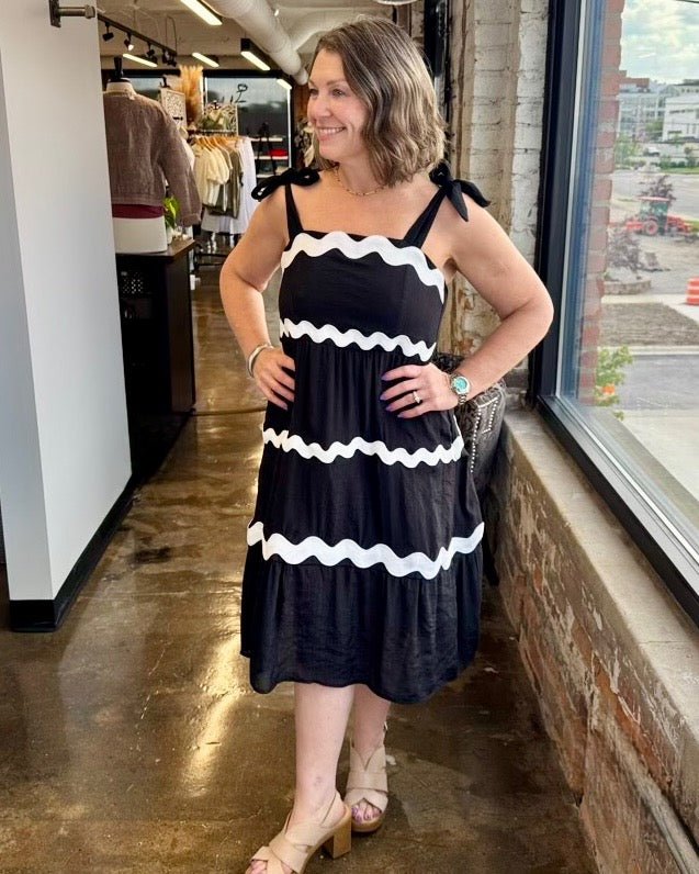 Tissue Faille Ric Rac Dress in Black/White, with ric-rac tiered skirt and bow tie shoulder straps, angled front view on model