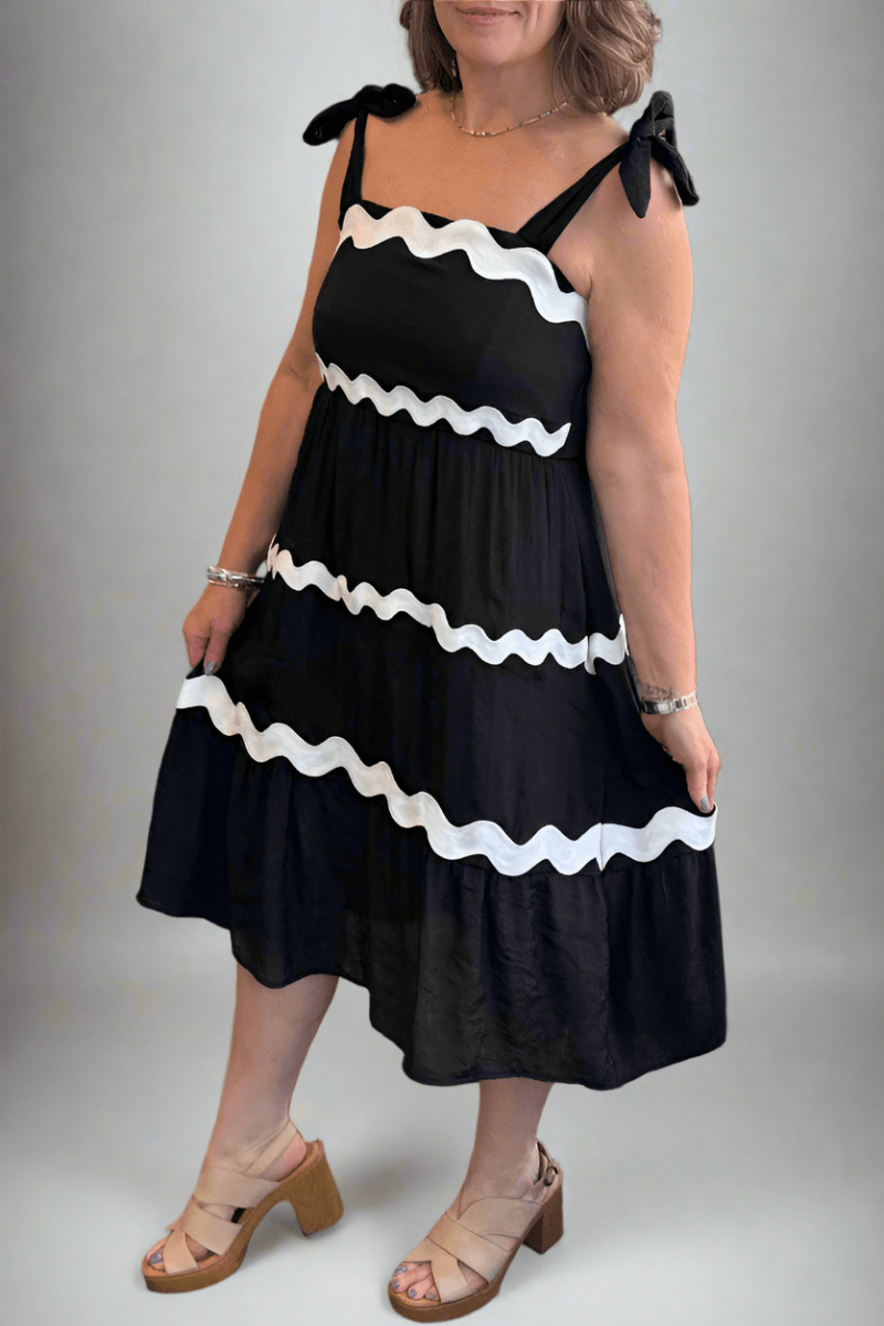 Close-up of the smocked bodice and square neckline on the Tissue Faille Ric Rac Trim Midi Dress.