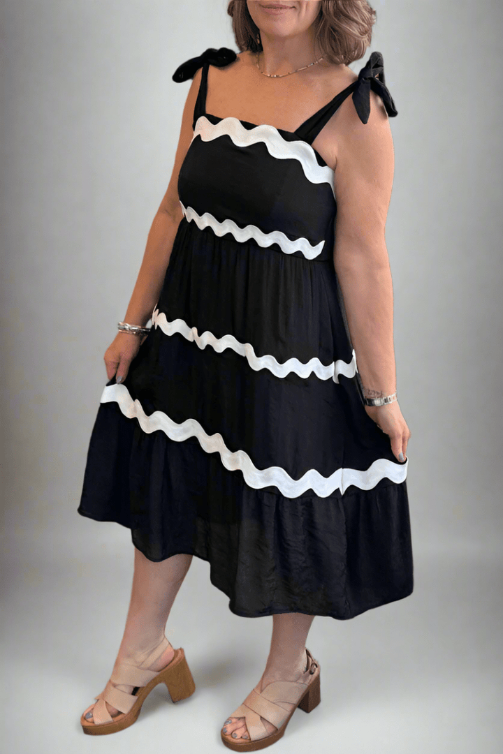 Close-up of the smocked bodice and square neckline on the Tissue Faille Ric Rac Trim Midi Dress.