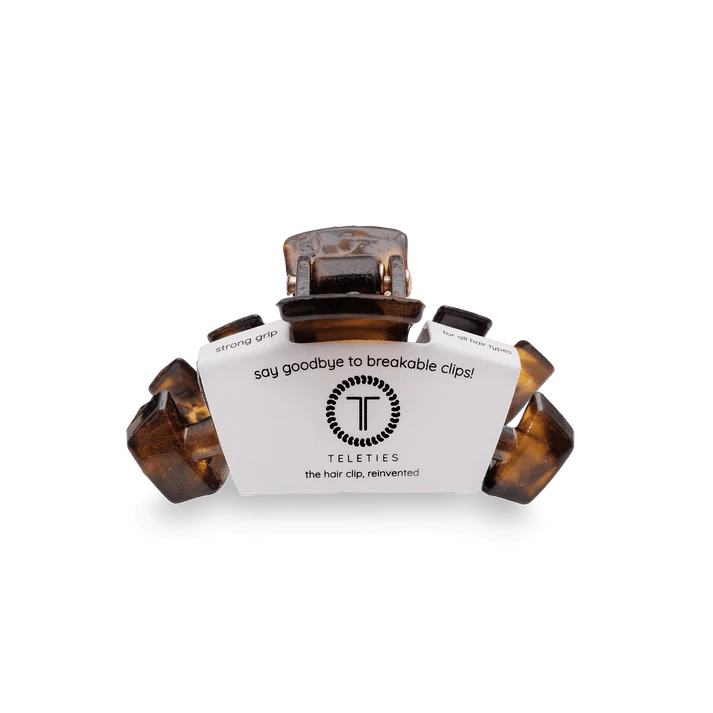 Hair clip with brand label on a white background