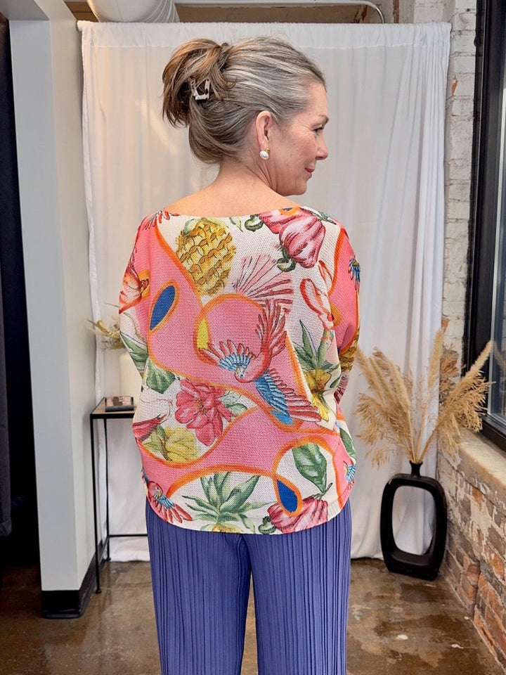 Back view of the Coral Multi Italian knit sweater showing the continuous tropical floral and bird print.