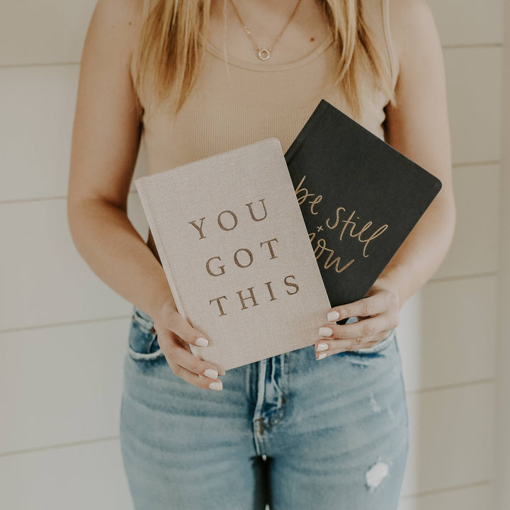 You Got This Journal held with another journal.