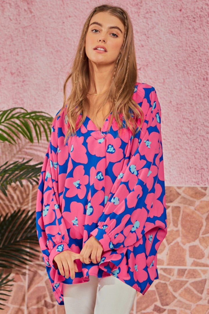 A relaxed-fit Emily Wonder brand floral tunic with a Modern Midwest aesthetic, available in plus sizes 1X/2X to 2X/3X.